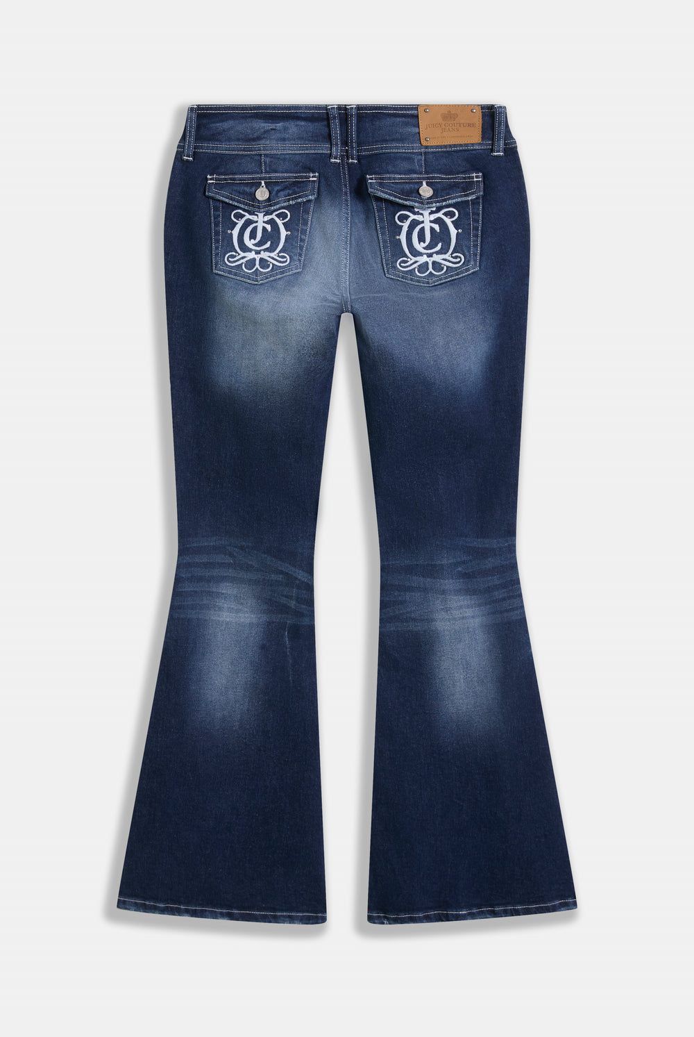 Displays the 'Juicy' branded mid wash low rise flare embroidered jeans