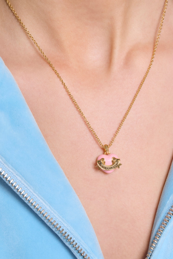 Displays a model wearing the Gold Tone 'Juicy' branded enamel icon heart pendant 