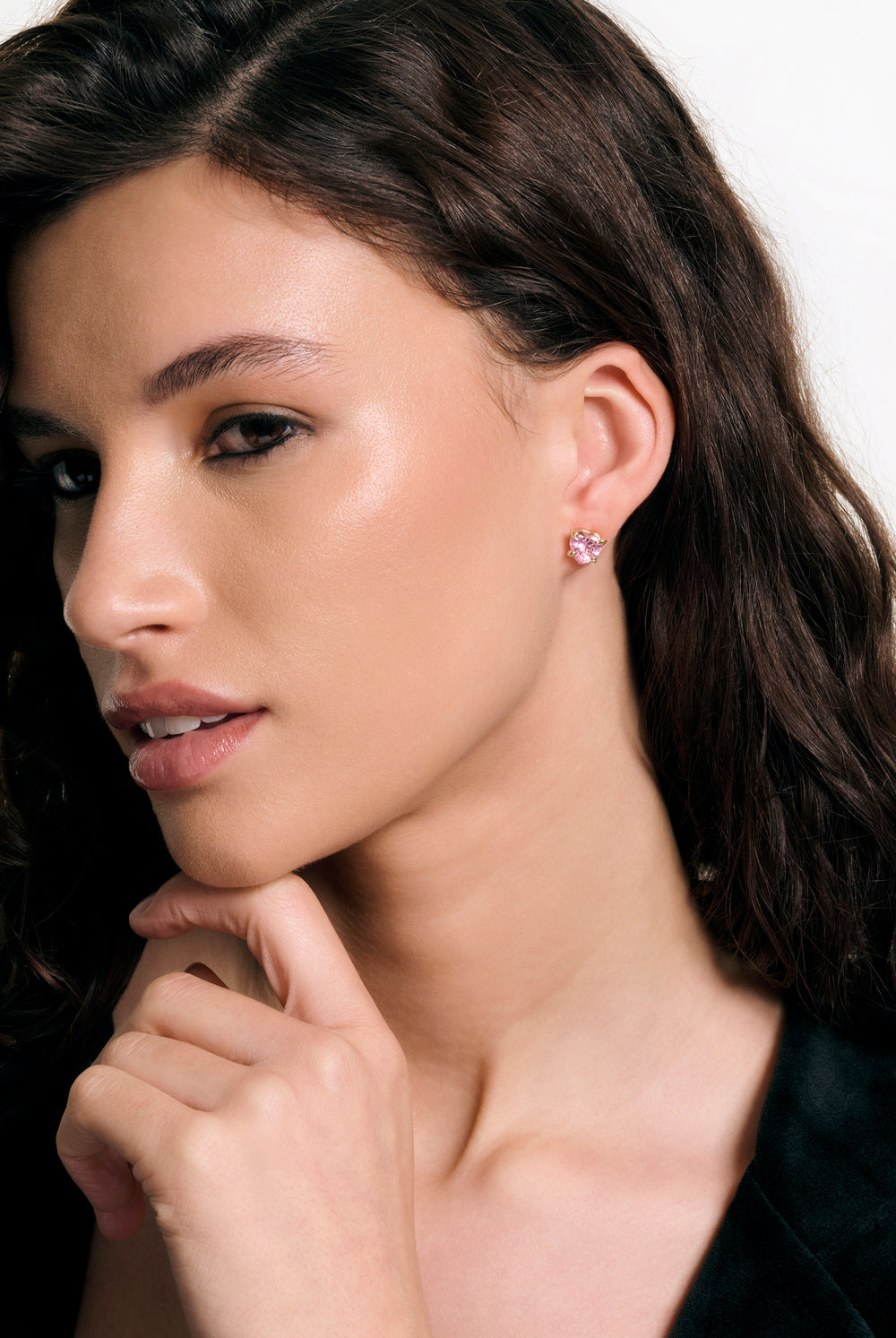 Displays a model wearing the Gold Tone 'juicy' branded solitaire crystal heart stud earring 