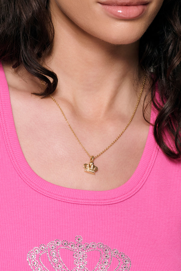 Displays a model wearing the Gold Tone 'Juicy' branded crystal Icon crown pendant 