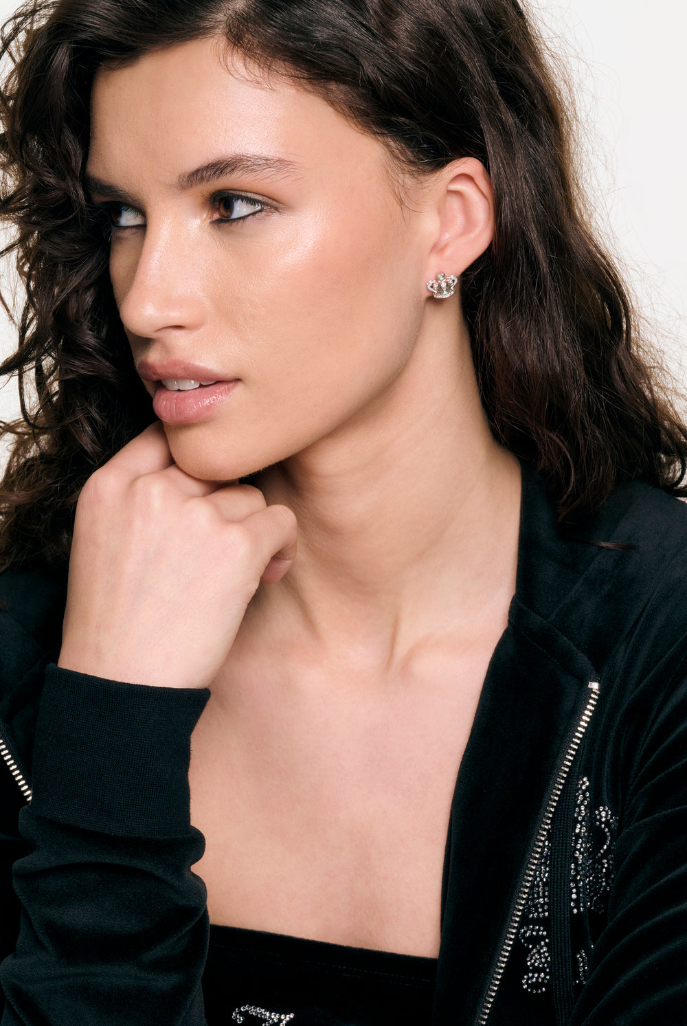 Displays a model wearing the Silver Tone 'Juicy' branded icon crown stud earrings 