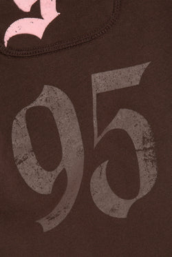 Displays a model wearing the Java 'Juicy' branded relaxed fit flare fleece trackpant featuring the 95 juicy branding 