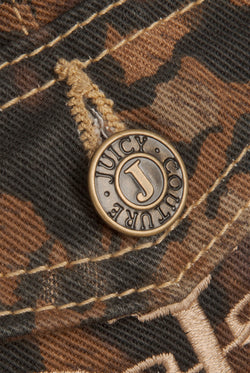 Displays the Animal 'Juicy' branded low rise flared jeans featuring the juicy Couture branding on the button