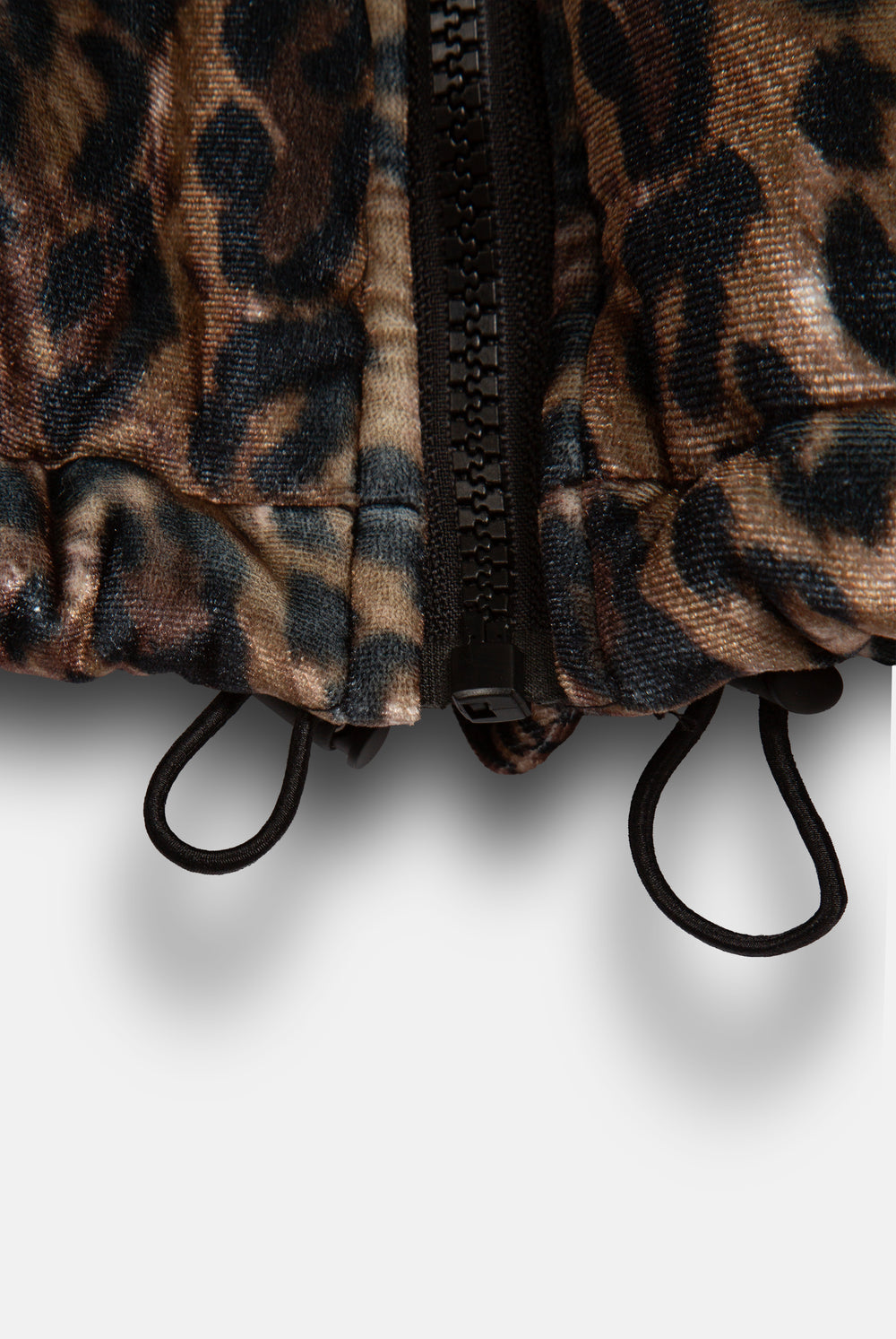 Displays the leopard print velour 'Juicy' branded puffa jacket