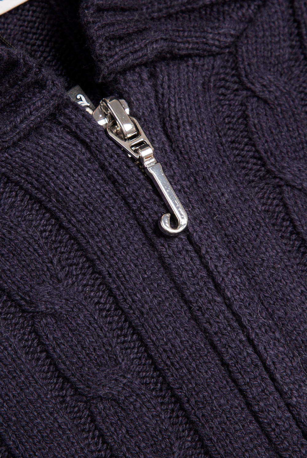 Displays the Night Sky 'Juicy' branded Cable Knit Zip Up Hoodie featuring the juicy branding on the zip