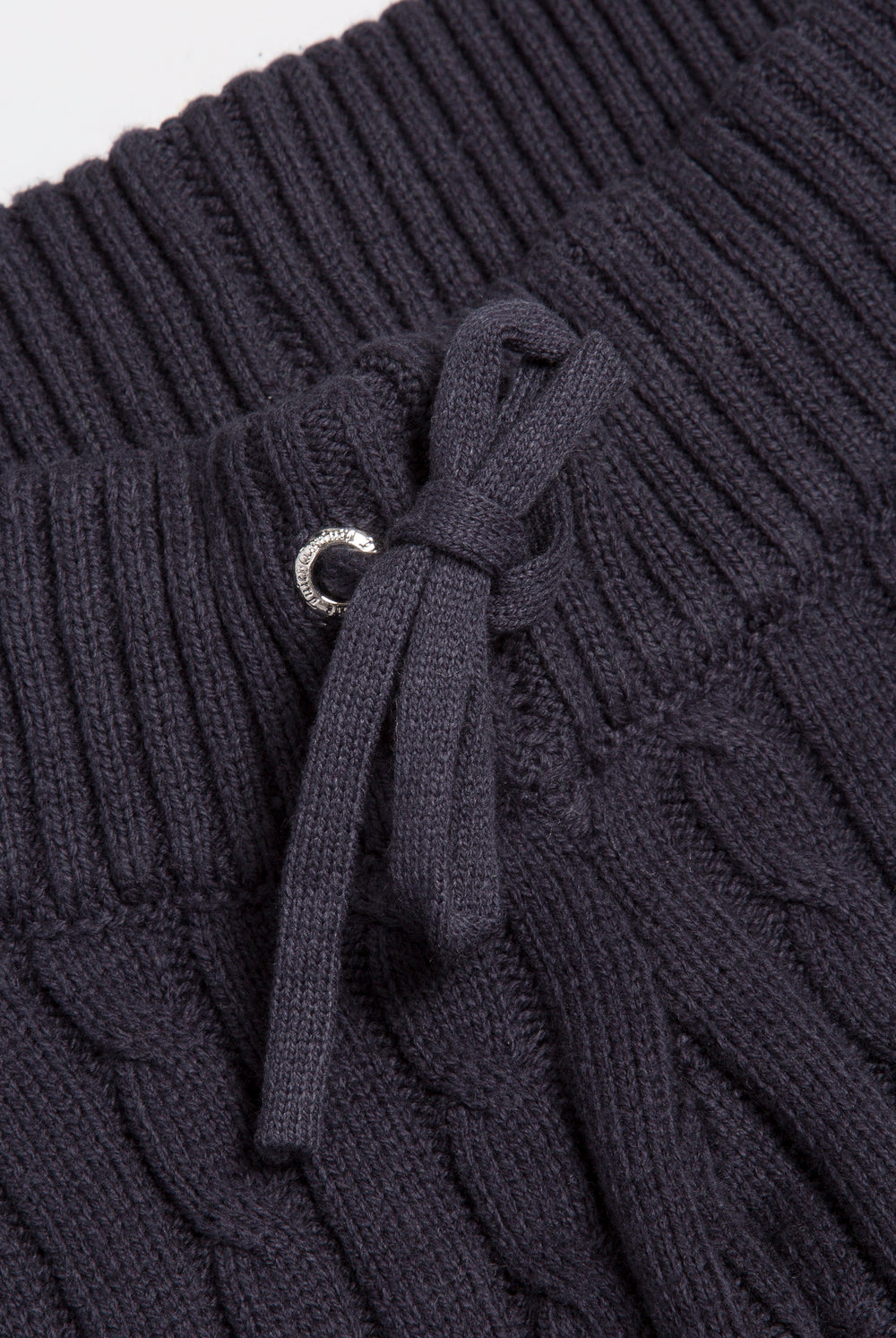 Displays the Night Sky 'Juicy' branded Cable Knit Straight Leg Pants featuring the close up on the straw string 