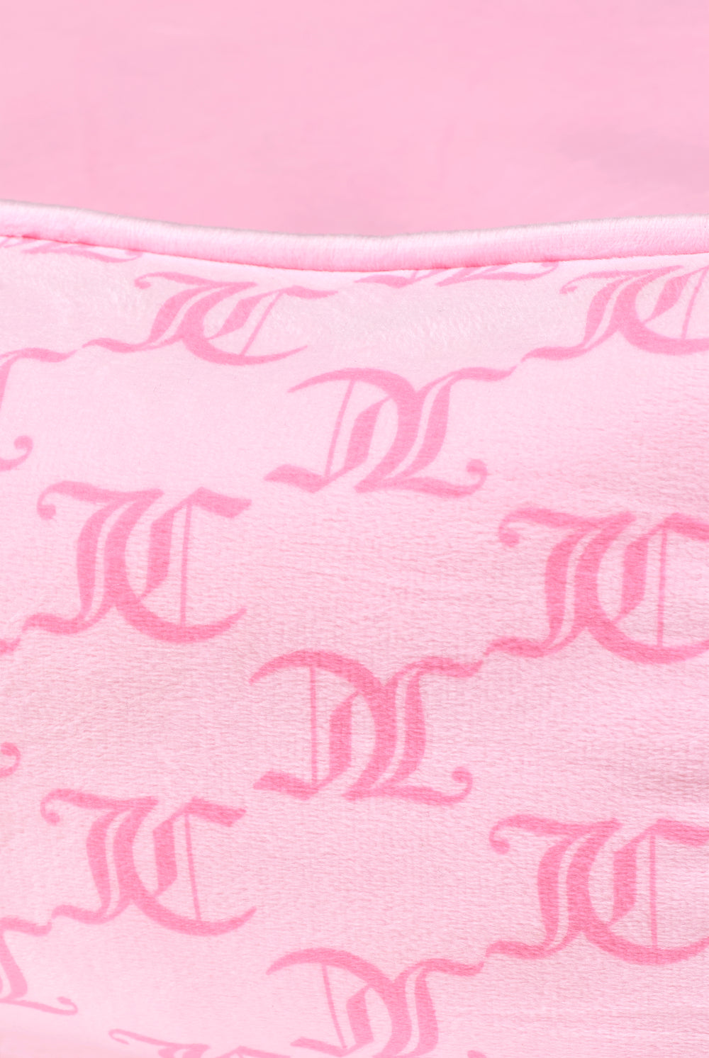 Displays the Juicy Pink 'Juicy' branded Pet Bed featuring the close up on the details 