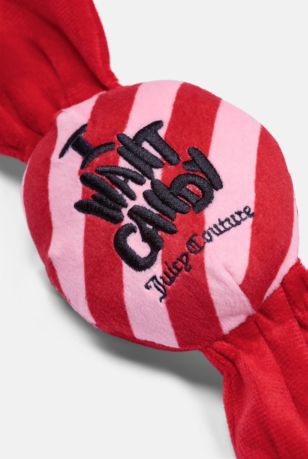 Displays the Red/Pink 'Juicy' branded Candy Pet Toy featuring the juicy couture branding
