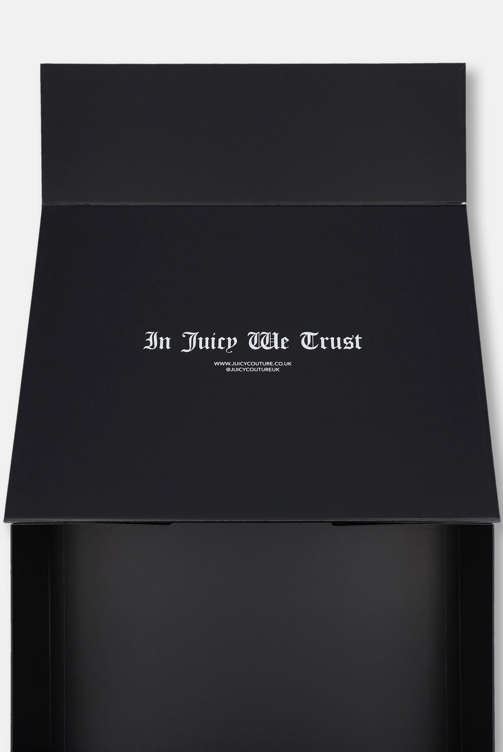 Displays the 'Juicy Couture' Gift Wrapping packaging 