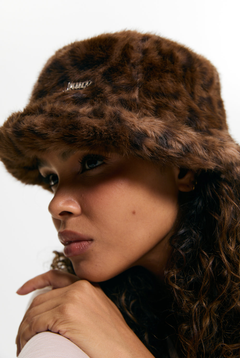 Displays a model wearing the Leopard Print 'Juicy' branded Plaque Fur Bucket Hat