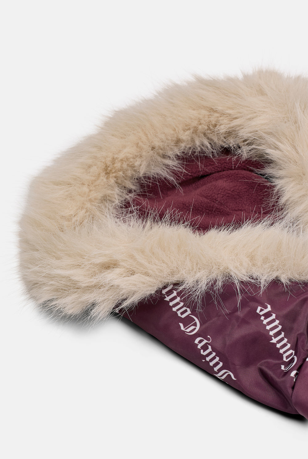 Displays the Winetasting 'juicy' branded Pet Puffer Jacket feauting the close up on the details 