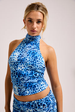 Displays a model wearing the Blue Leopard print 'Juicy' branded jersey halter neck top 