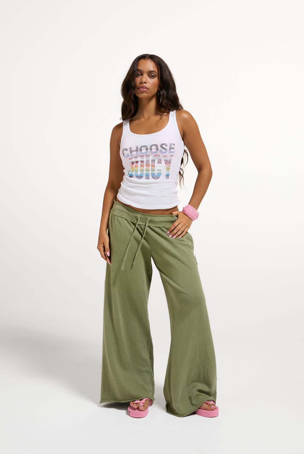 Displays a model wearing the White 'Juicy' branded Choose juicy vest top 