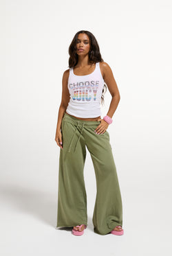 Displays a model wearing the White 'Juicy' branded Choose juicy vest top 