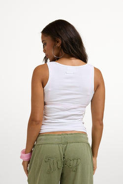 Displays a model wearing the White 'Juicy' branded Choose juicy vest top 