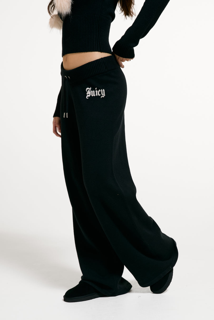 Displays a model wearing the Black 'Juicy' branded Knit Diamanté Trackpant