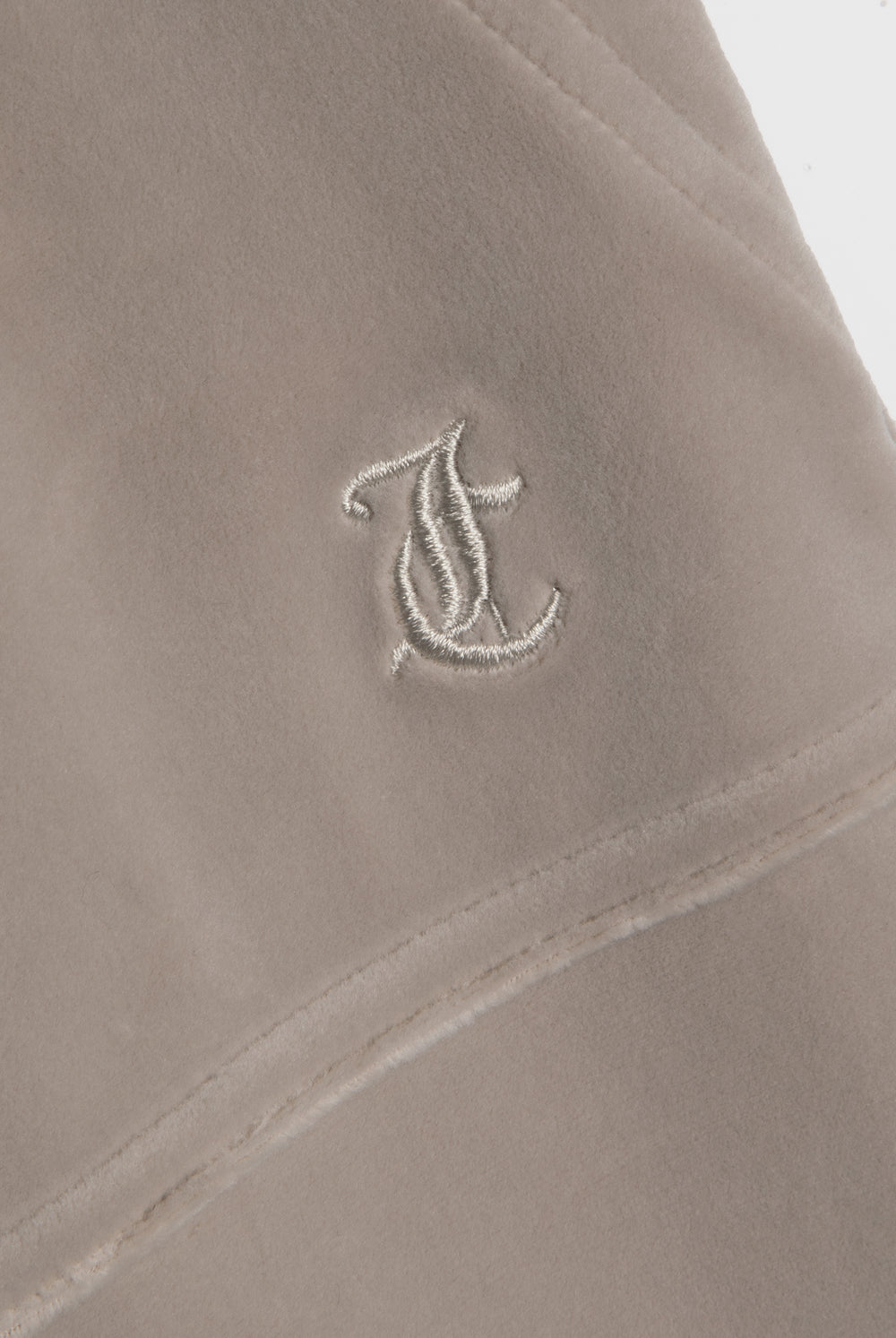 Displays the String 'Juicy' branded low rise flare pocket classic velour track pant featuring the juicy branding