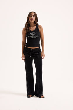 Displays a model wearing the Black Low rise flare pocket 'Juicy' branded classic velour track pant