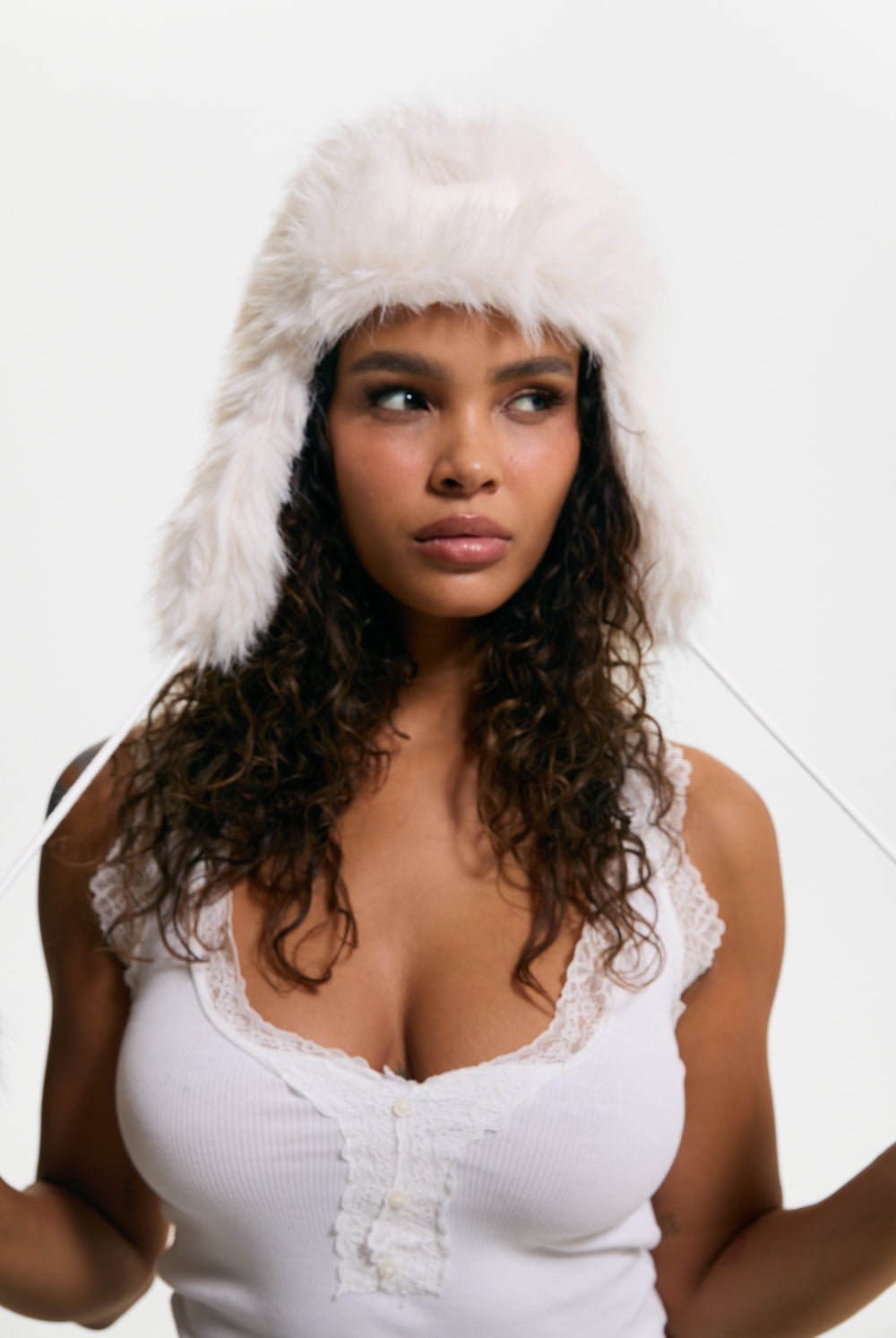Displays a model wearing the Sugar Swizzle 'Juicy' branded Long Pile Trapper Hat