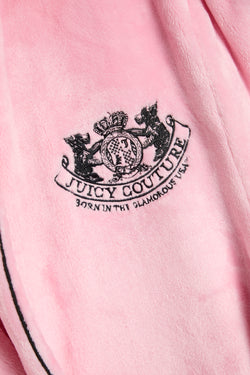 Displays the Juicy Pink 'Juicy' branded Plush Crest Robe featuring the juicy logo branding