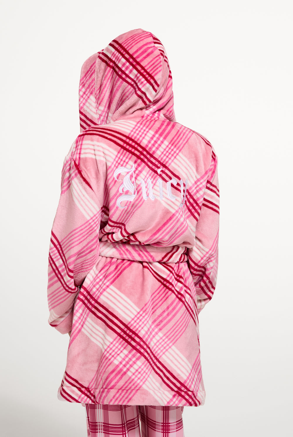 Displays a model wearing the Pink 'Juicy' branded Check Plush Robe