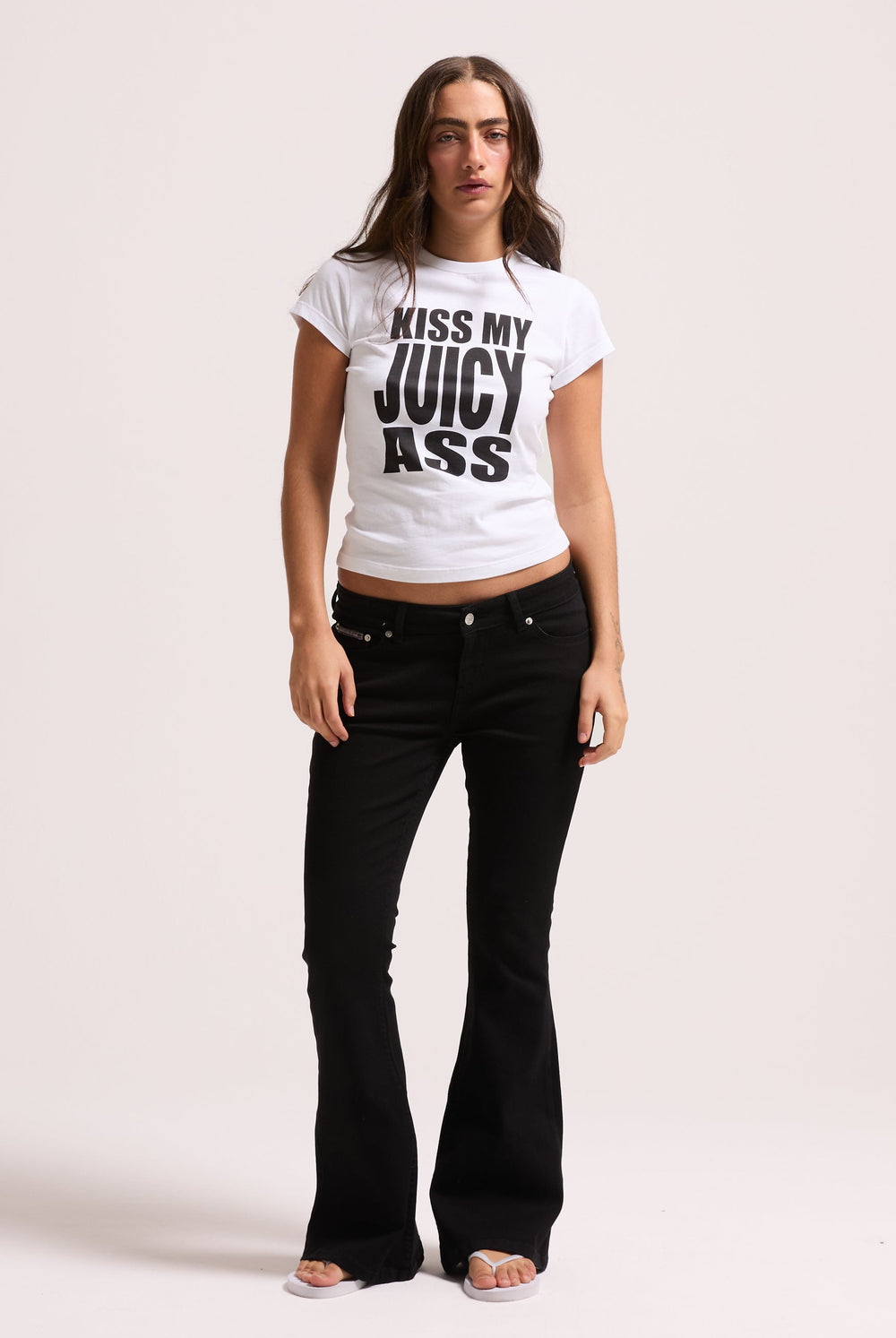 Displays a model wearing the Black stretch 'Juicy' branded twill low rise flare jeans 