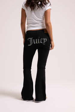 Displays a model wearing the Black stretch 'Juicy' branded twill low rise flare jeans 