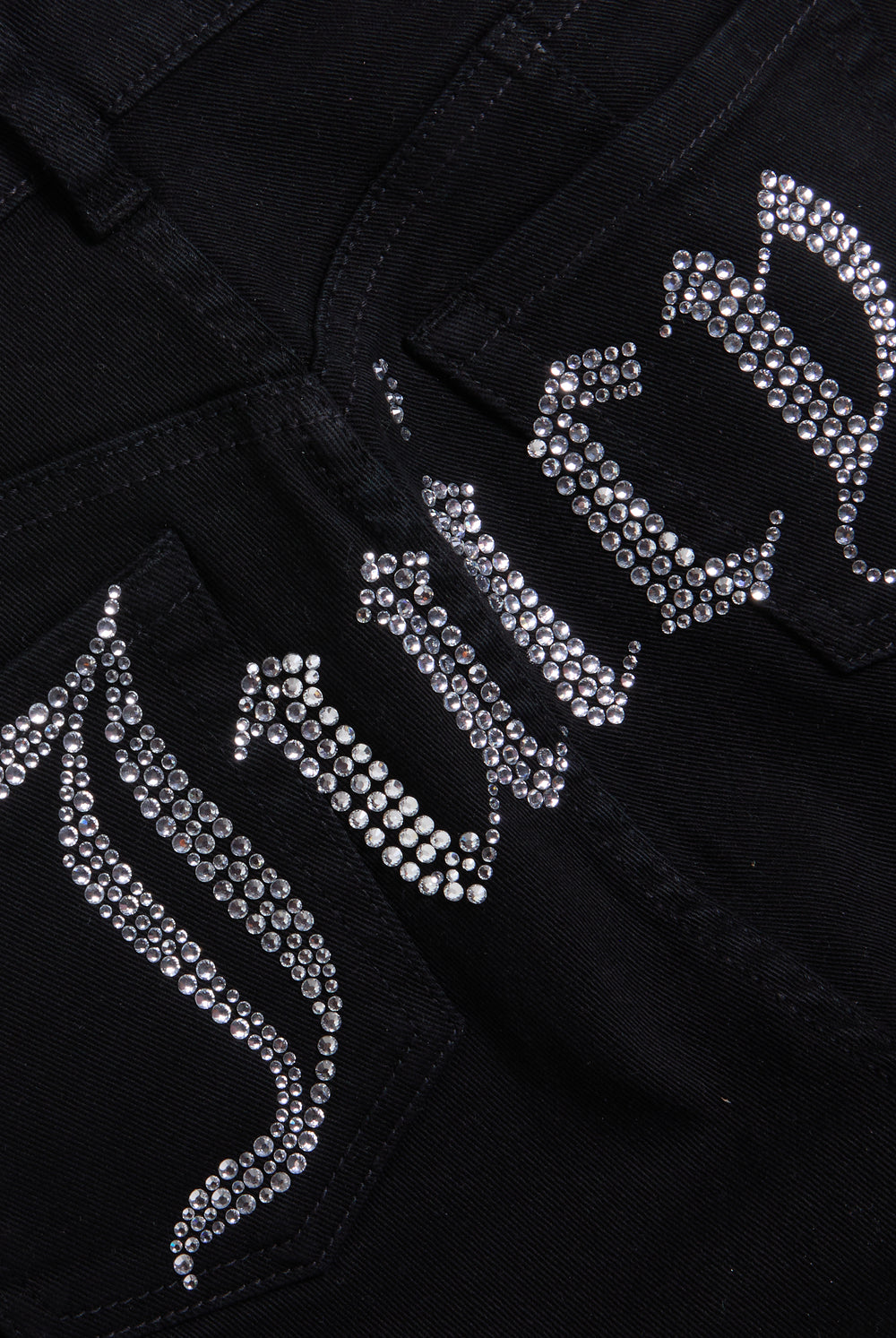 Displays a model wearing the Black stretch 'Juicy' branded twill low rise flare jeans featuring the juicy branding 