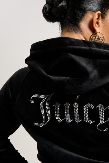 Woman wearing Black velour hoodie with Juicy Diamanté on the back