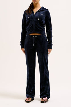 Displays a model wearing the Night Sky 'juicy' branded velour diamanté tracksuit bottom