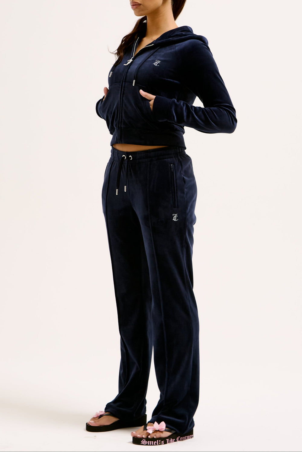 Displays a model wearing the Night Sky 'juicy' branded velour diamanté tracksuit bottom