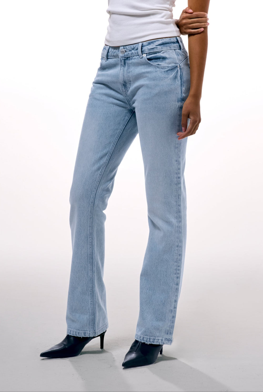 Displays a model wearing the Light Wash 'Juicy' branded Diamanté bootcut jeans  
