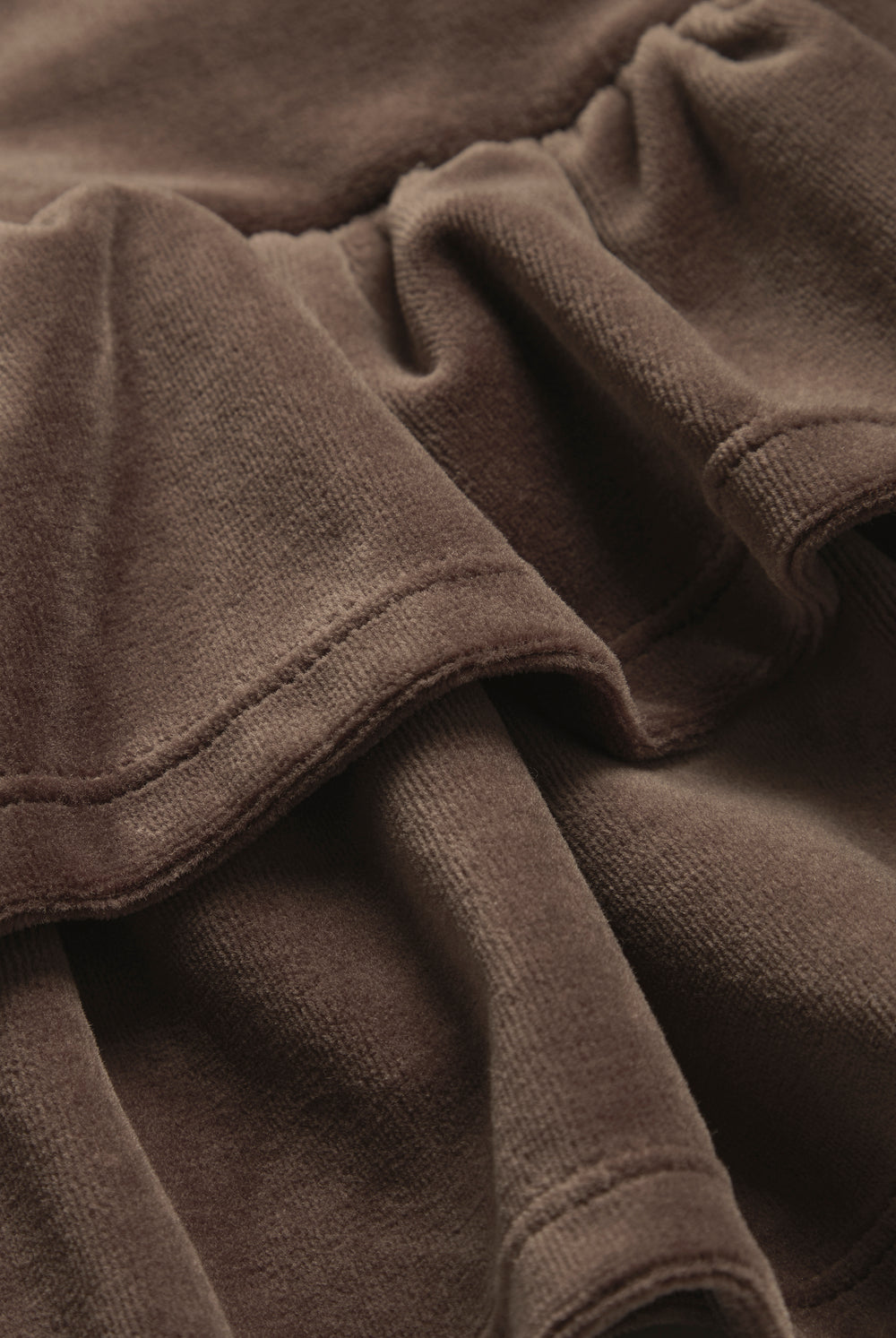Displays the Java 'juicy' branded Cotton Velour Ruffle Skirt featuring the close up on the details 