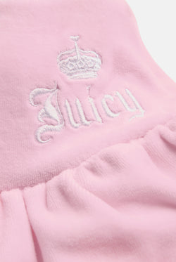 Displays the Cherry Blossom 'Juicy' branded Cotton Velour Ruffle Skirt featuring the details on the juicy branding 