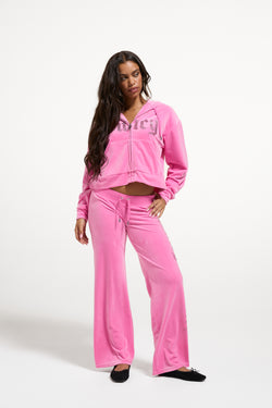 Displays a model wearing the Wild Orchid 'Juicy' branded Old Gothic Diamante OG Straight Leg Trackpant