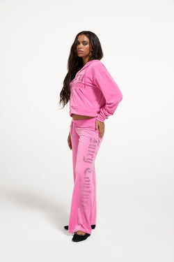 Displays a model wearing the Wild Orchid 'Juicy' branded Old Gothic Diamante OG Straight Leg Trackpant