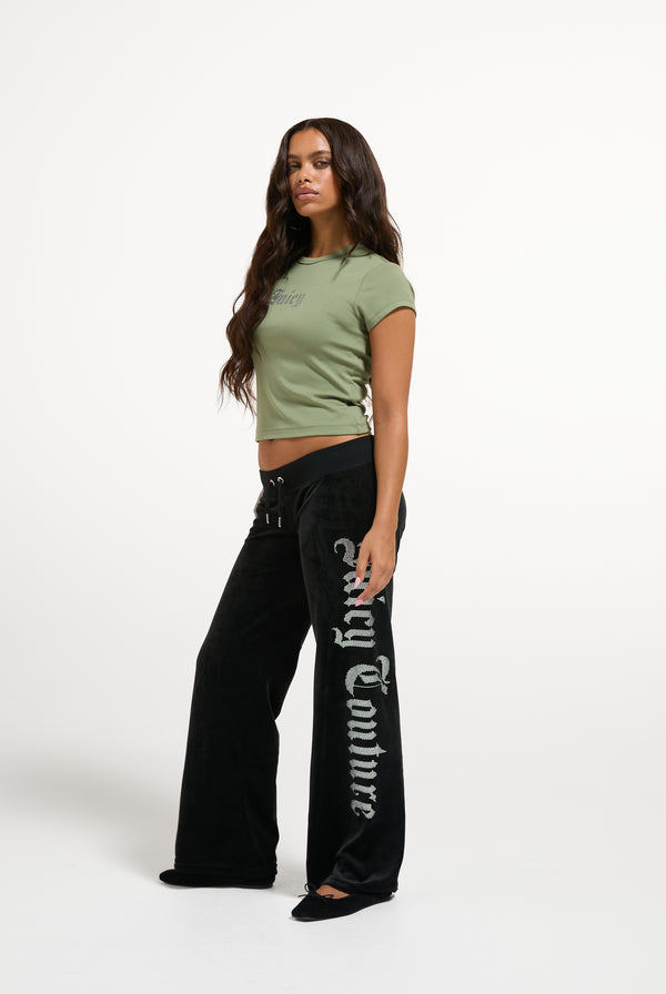 Displays a model wearing the Oil Green 'Juicy' branded Old Gothic Baby T-Shirt