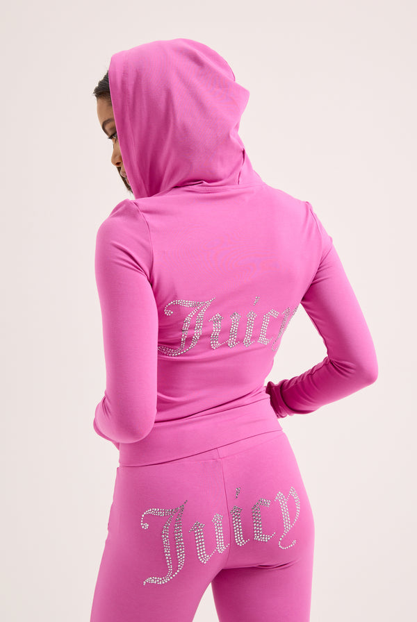 Displays a model wearing the Super Pink 'Juicy' branded Diamanté luxury jersey zip-through hoodie 