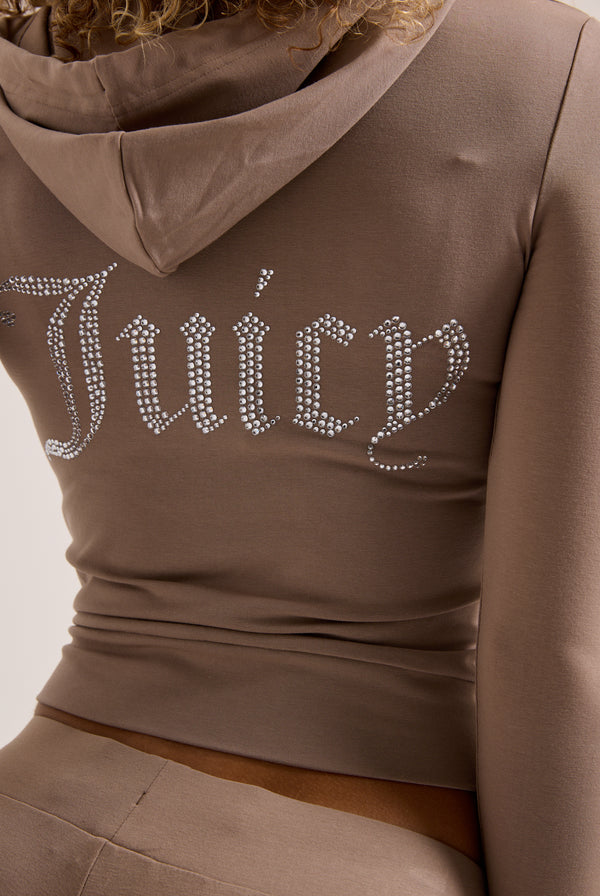 Displays a model wearing the Fungi 'Juicy' Couture diamanté luxury jersey zip through hoodie featuring the juicy branding