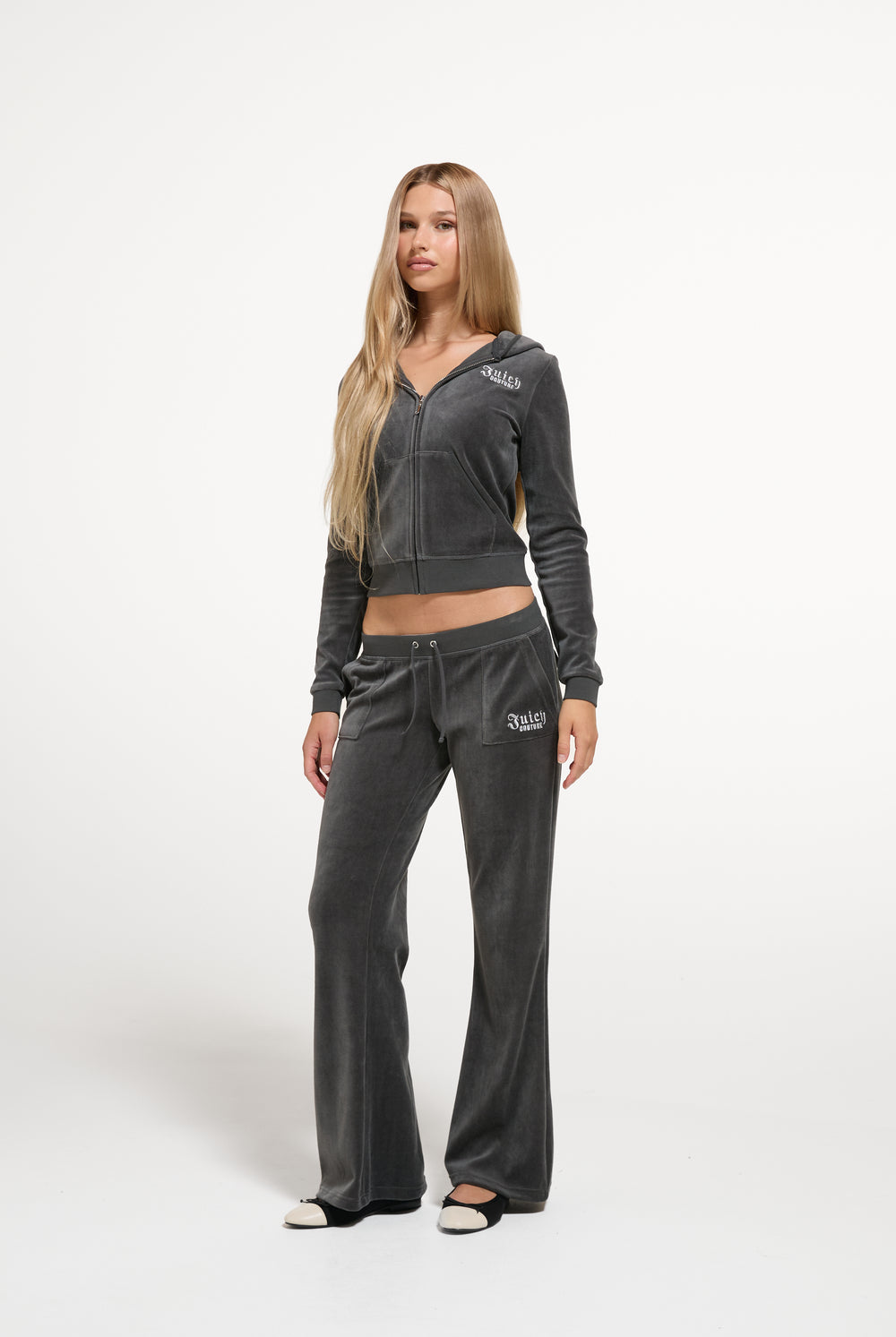 Displays a model wearing the Raven 'Juicy' branded Regal Rebelle Robyn Hoodie