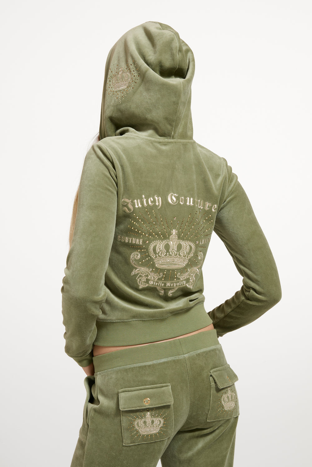 Displays a model wearing the Oil Green 'Juicy' branded Regal Rebelle Robyn Hoodie