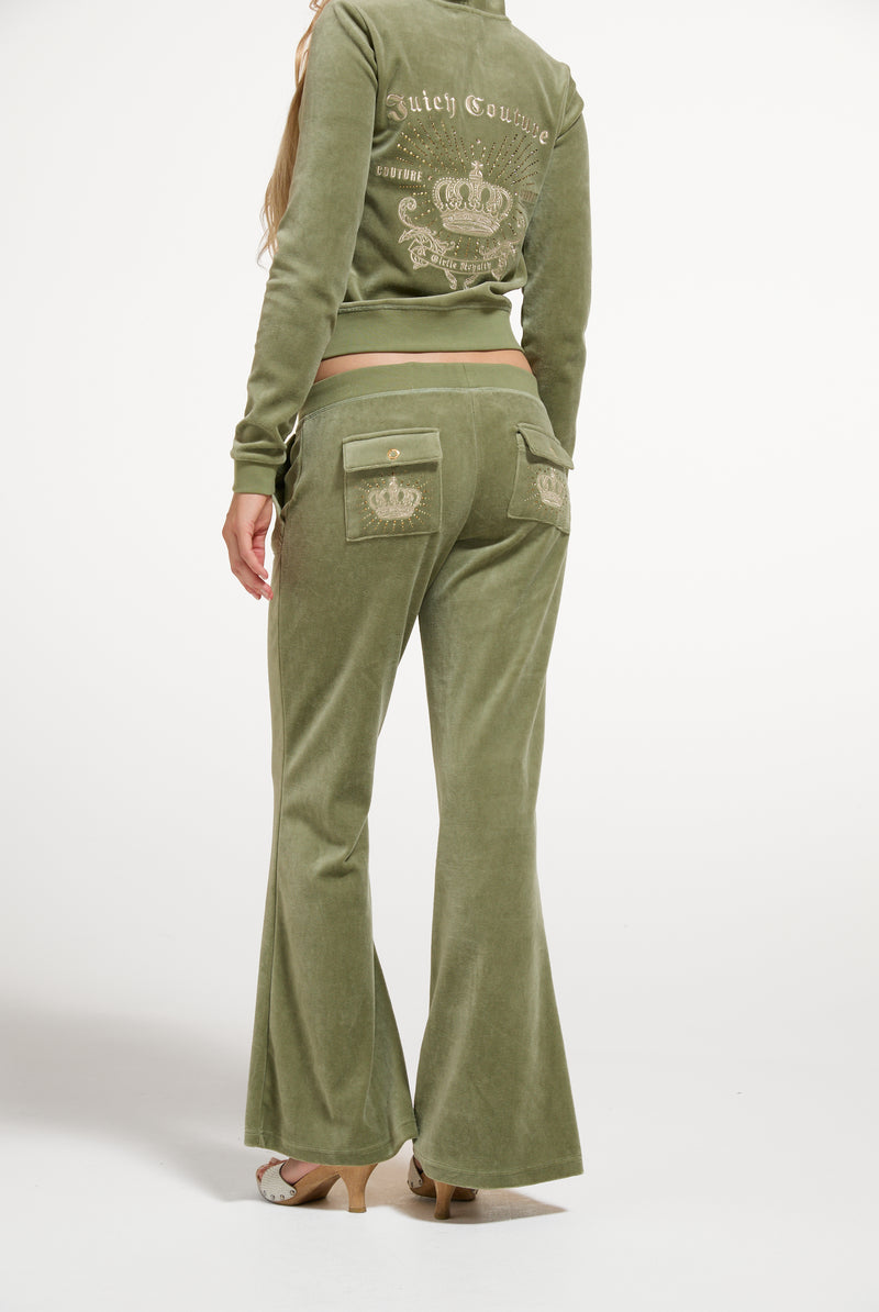 Displays a model wearing the Oil Green 'Juicy' branded Regal Rebelle Caisa Ultra Low Rise Pant