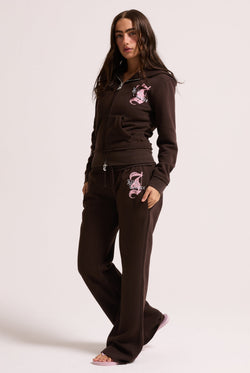 Displays a model wearing the Java longline 'Juicy' branded fleece zip through hoodie 