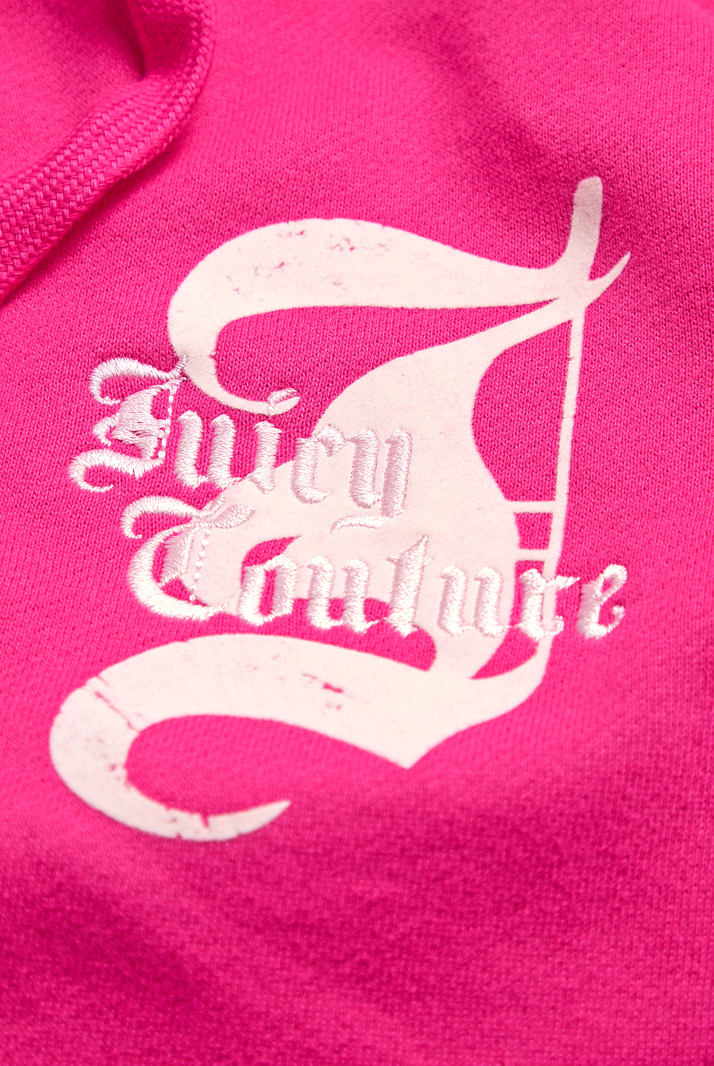 Displays the Nostalgia Pink 'Juicy' branded Longline Fleece Zip-Through Hoodie featuring the juicy branding 