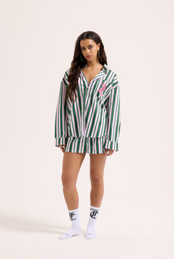 Displays a model wearing the Green stripe 'juicy' branded cotton sleep shirt 