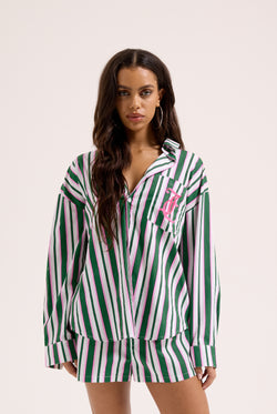 Displays a model wearing the Green stripe 'juicy' branded cotton sleep shirt 