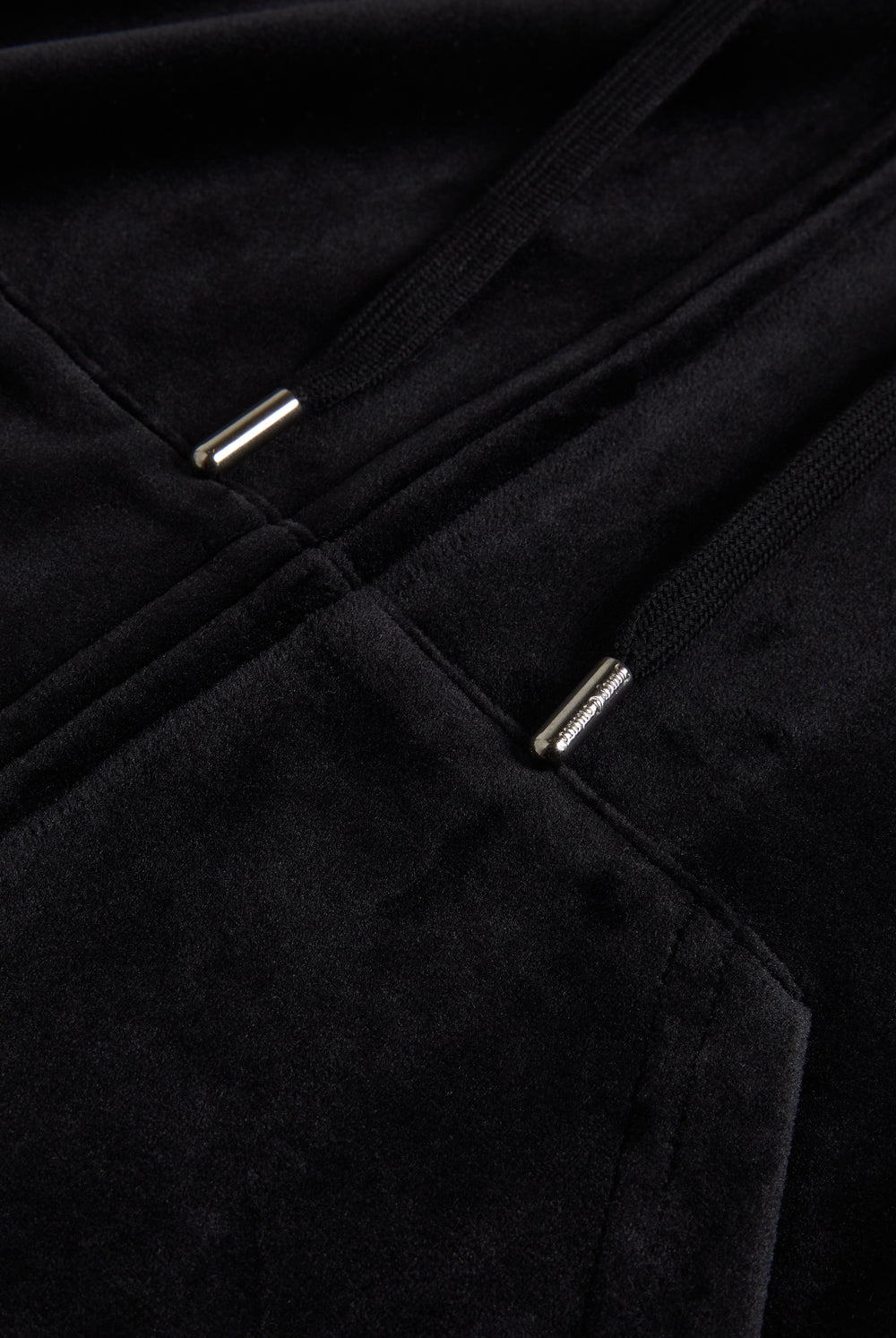 Close up of a black velour hoodie