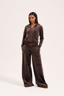 Displays the model wearing the Java & Gold 'Juicy' branded classic velour Robertson hoodie 