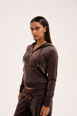 Displays the model wearing the Java & Gold 'Juicy' branded classic velour Robertson hoodie 