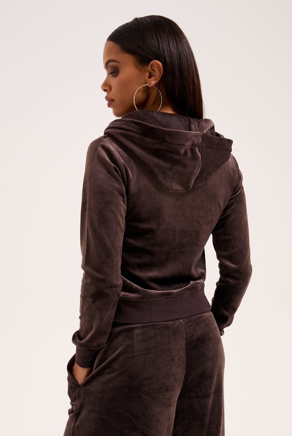Displays the model wearing the Java & Gold 'Juicy' branded classic velour Robertson hoodie 